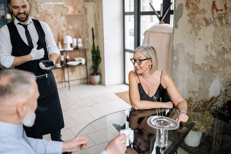 Image: Waiter with happy customer